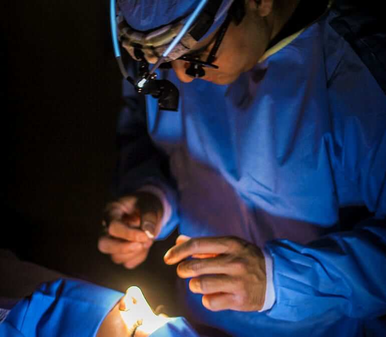 Dr. Deepak Dugar, a nose job specialist, doing a scarless nose rhinoplasty on a female patient